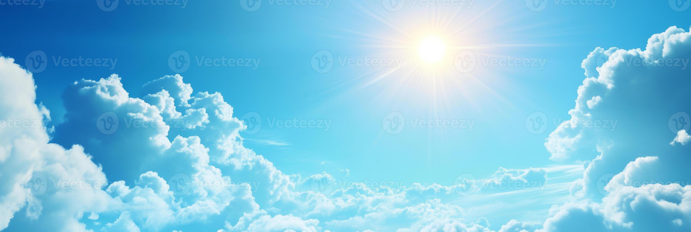 The stunning and breathtaking view of a clear blue sky adorned with fluffy, white clouds and warm, golden sunlight truly captures the incredible beauty and serene peace of nature we experience daily photo