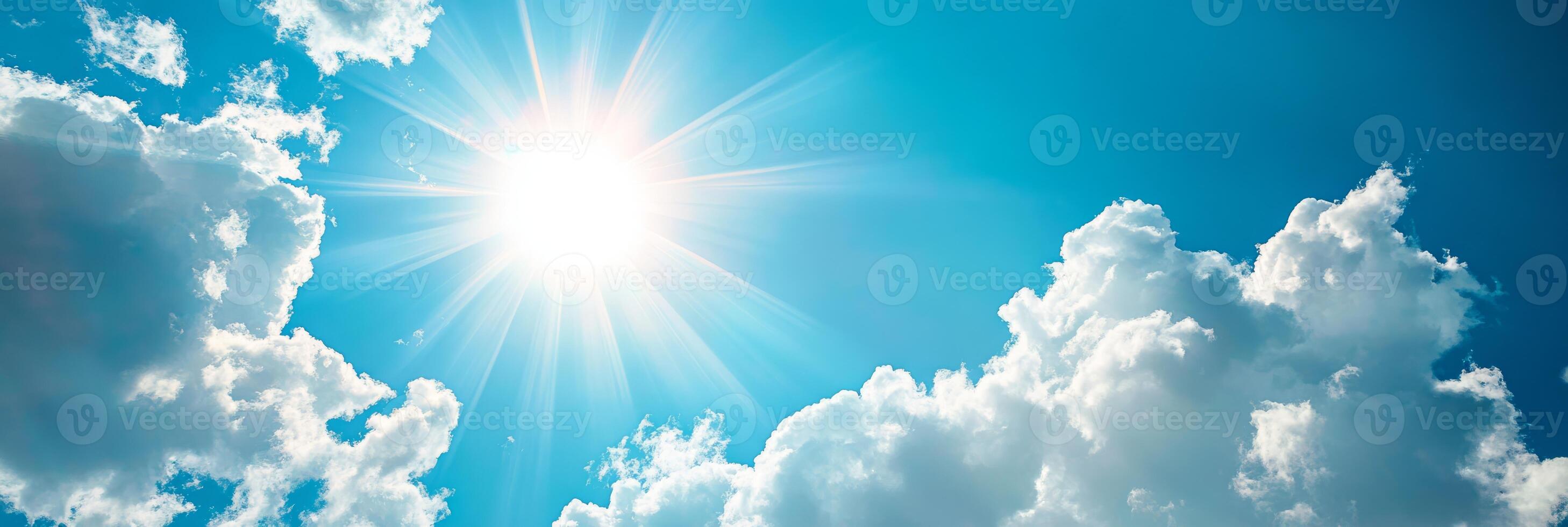 A truly serene and uplifting scene that features bright sunlight streaming down through fluffy white clouds in a clear blue sky, perfectly embodying the very essence of a peaceful summer day photo