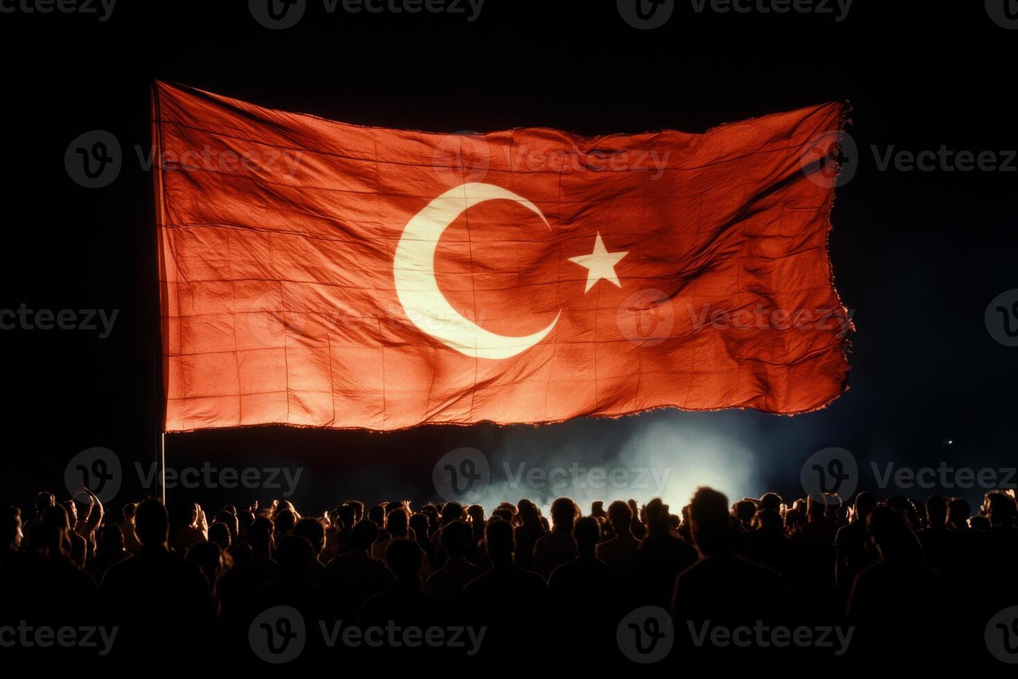 The national flag of Turkey vibrantly symbolizes the deep sense of national pride that emerges during public celebrations, reflecting unity and strong patriotism within the Republic of Turkey photo