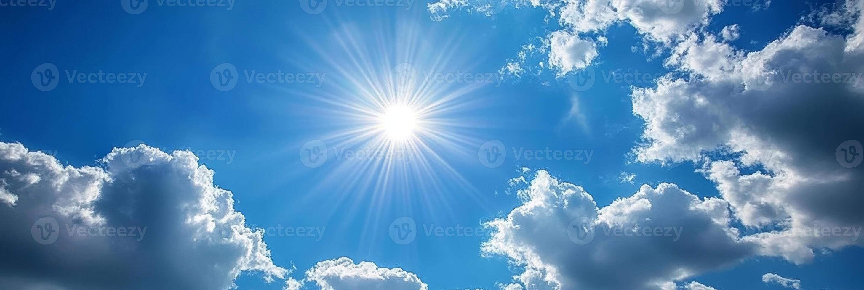 A serene and picturesque view of a bright blue sky that is filled with fluffy white clouds and shimmering radiant sunlight, perfectly embodying peace and beautiful harmony found in nature photo