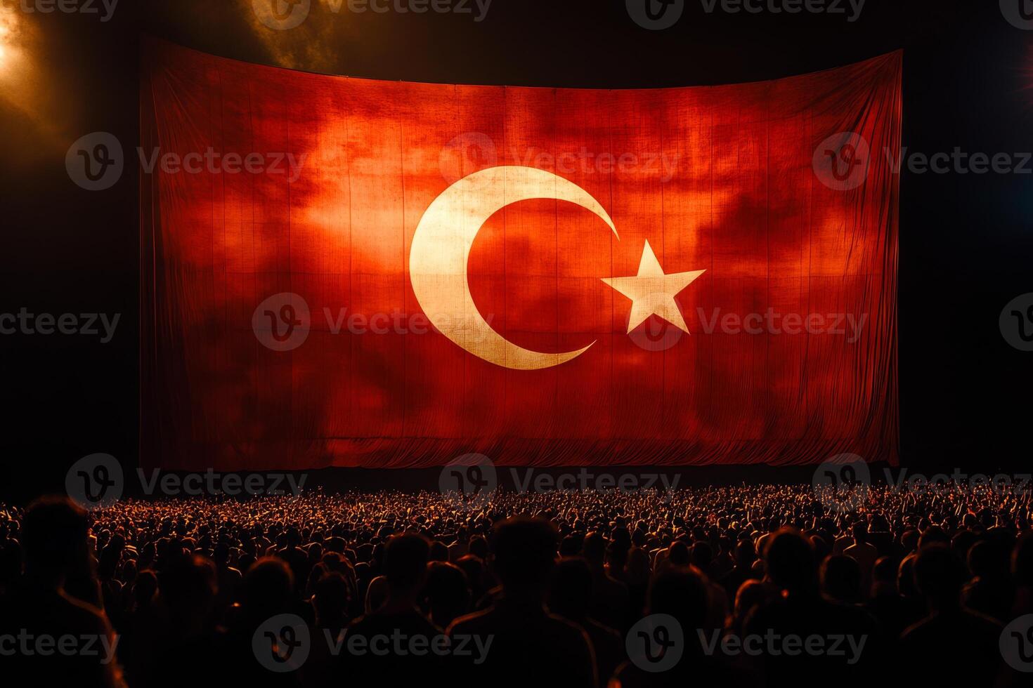 A large Turkish flag, with its vivid red background and white star, is proudly showcased during a celebration symbolizing national pride, unity, and the cultural heritage of the Turkish people photo