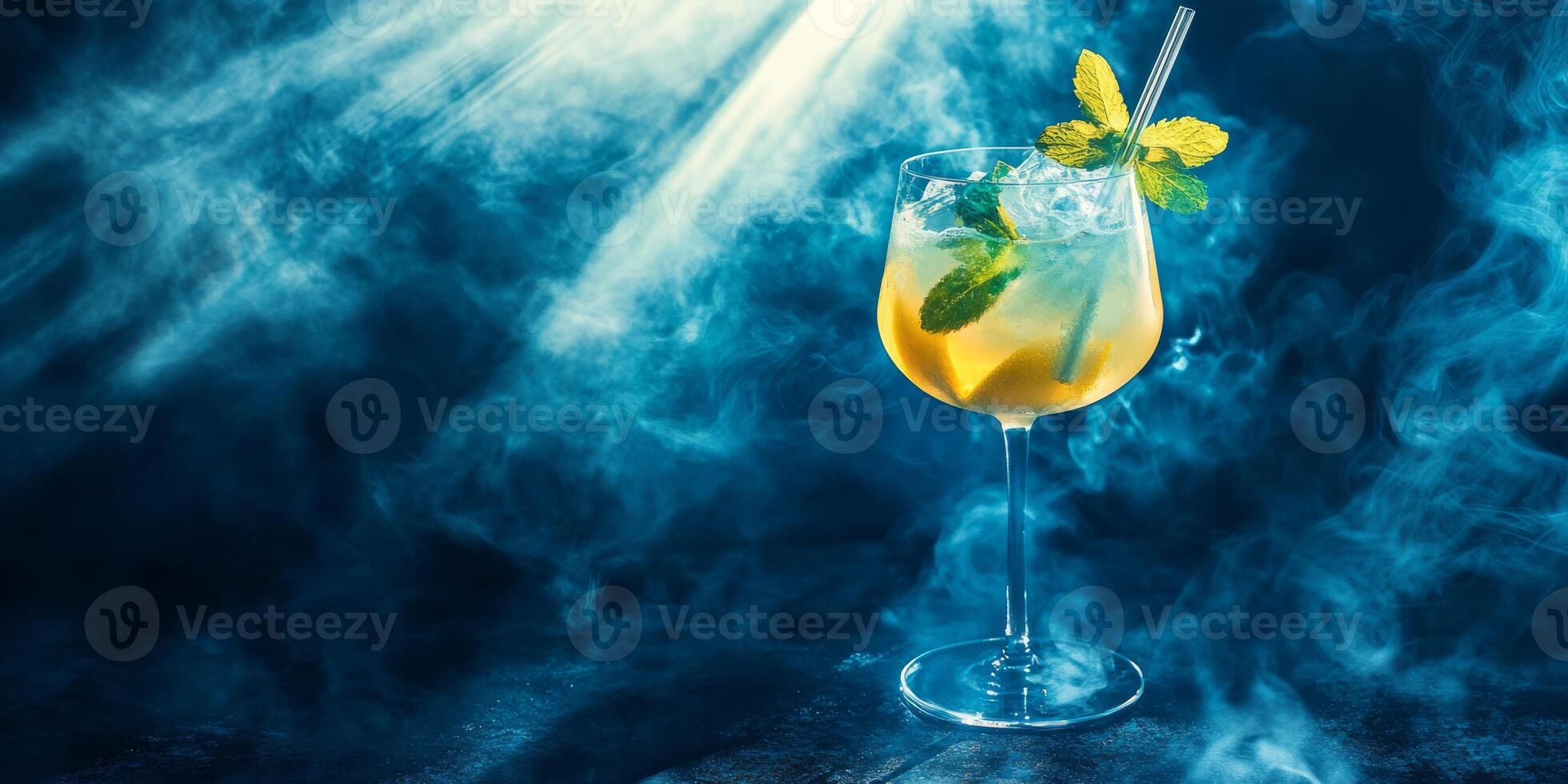 Enjoy a refreshing cocktail with mint and lemon in an elegant glass with an ecofriendly straw. Perfect for gatherings, this bubbly mix is a testament to gourmet mixology and sustainability photo