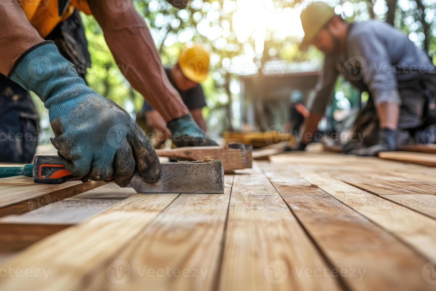 A skilled team is constructing a highquality wooden floor for a home improvement project, using specialized tools and premium materials to showcase their craftsmanship and dedication to excellence photo