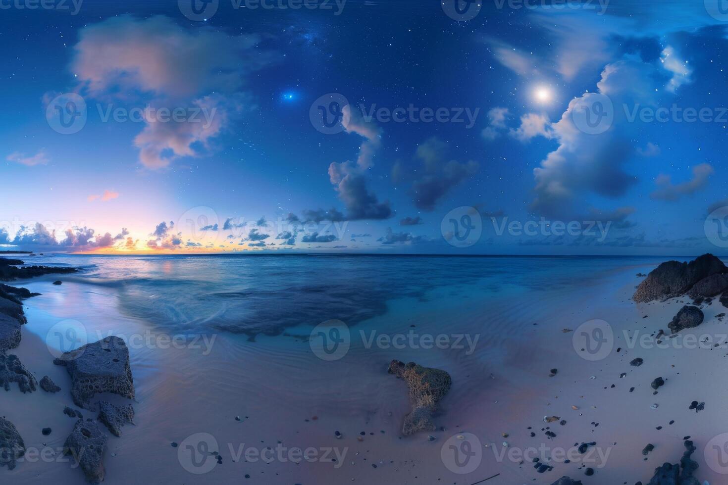 Starry night over tranquil tropical beach with twilight glow photo