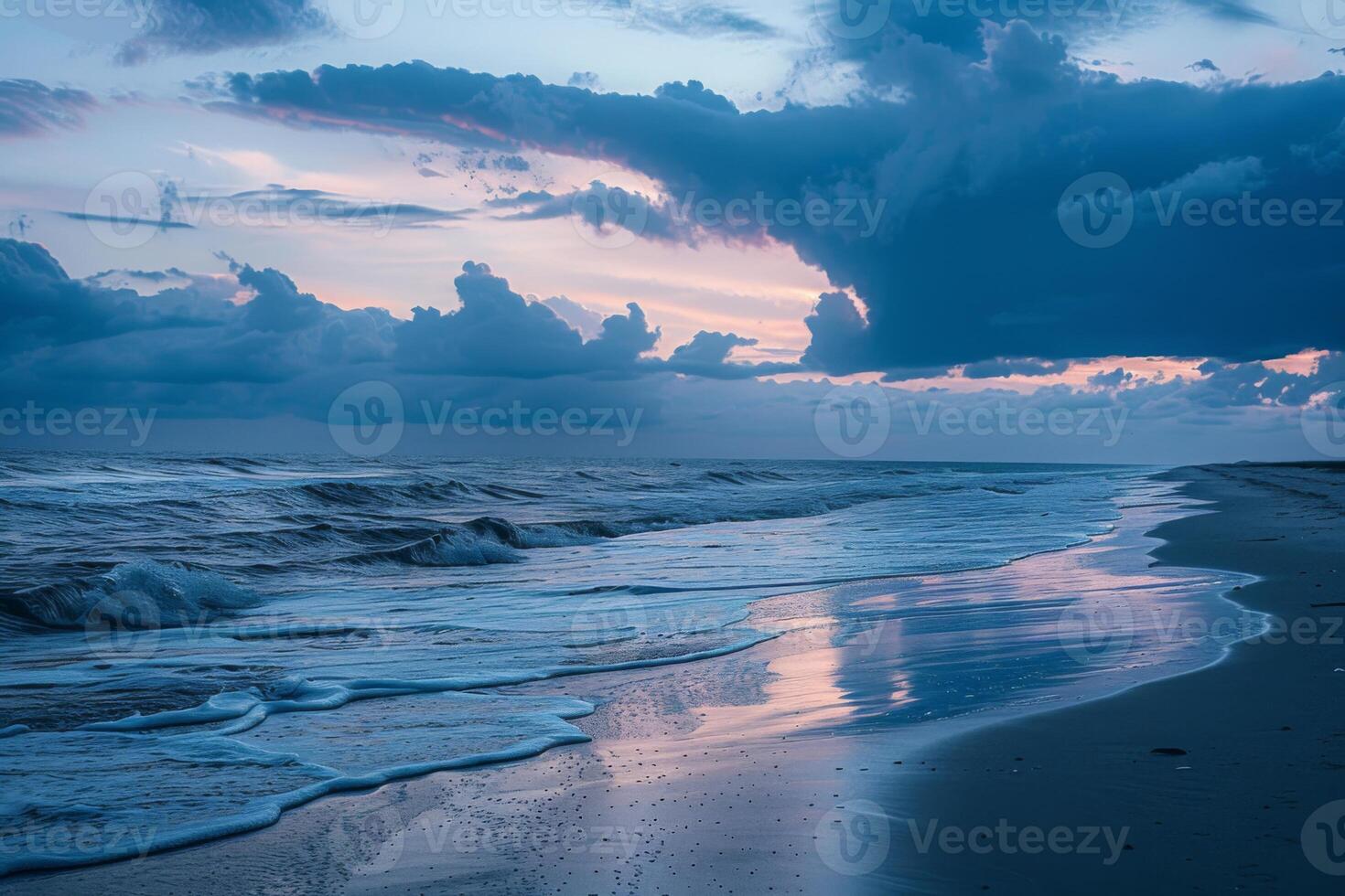 Storm clouds over ocean waves at twilight photo
