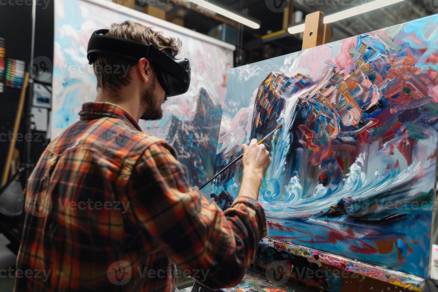 Artist Painting on Canvas While Using VR Headset photo