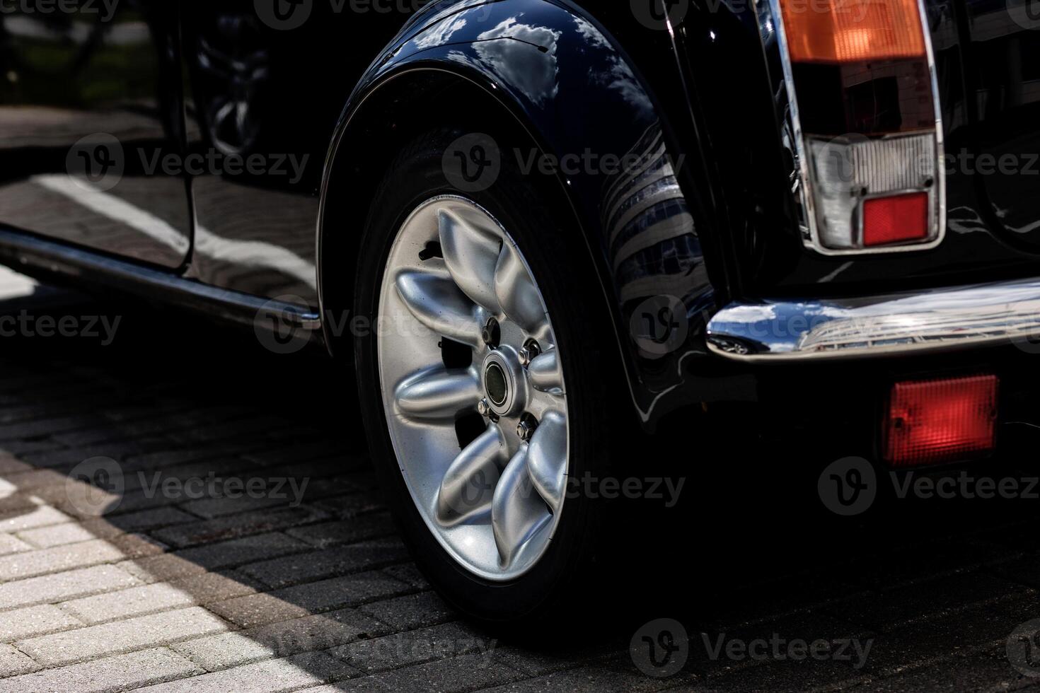 front wheel of old black car photo