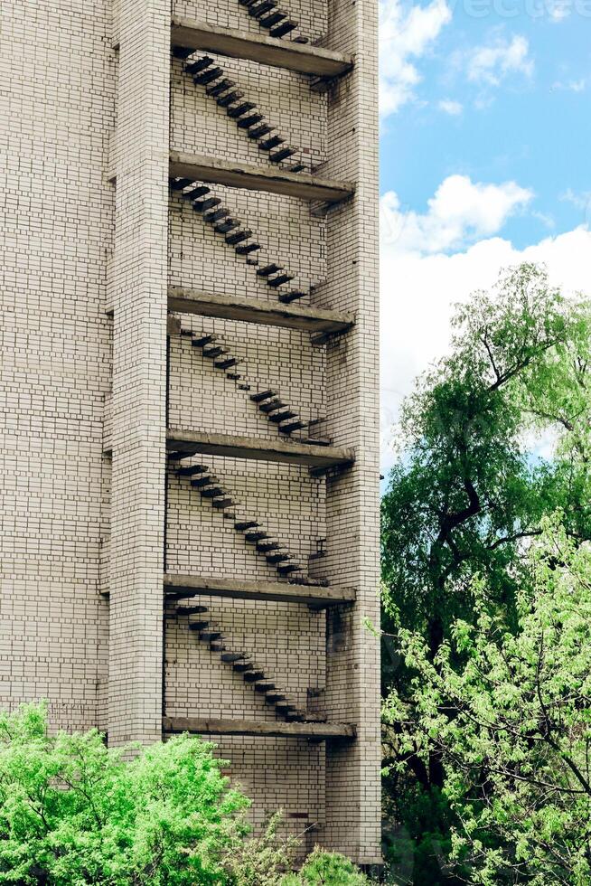 Abandoned empty city, multi-storey building. Empty rooms without windows. photo