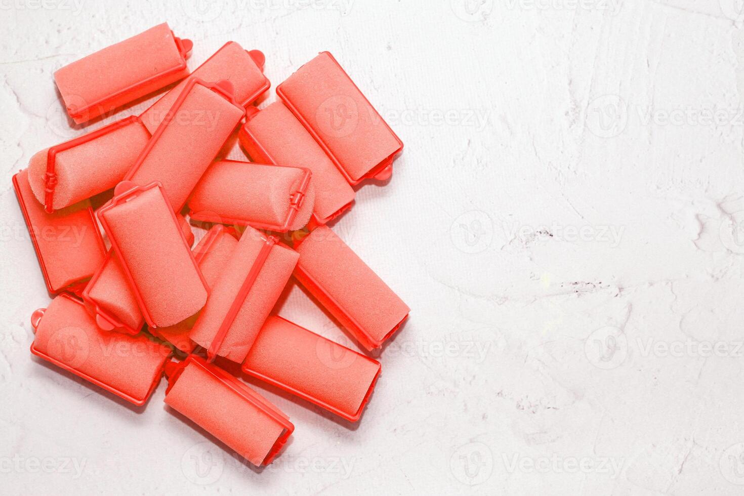 Soft foam comfortable hair curlers on a solid background photo