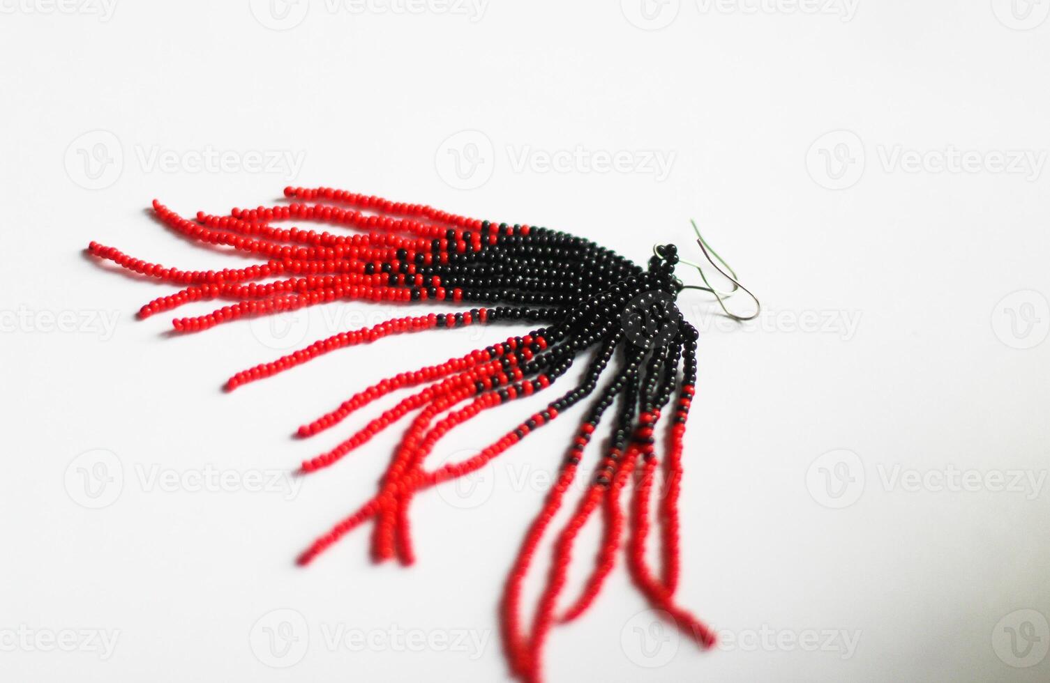 Black red handmade beaded earrings on a white background photo