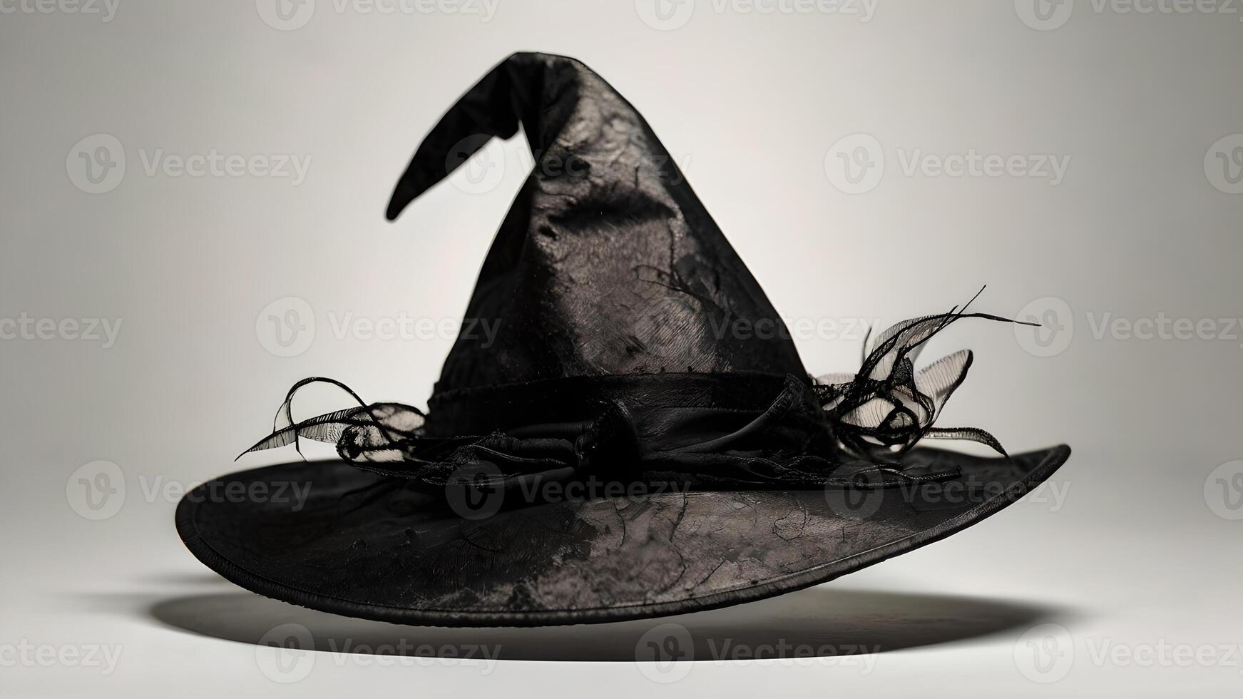 Black Witch Hat Isolated On White Background For Halloween photo