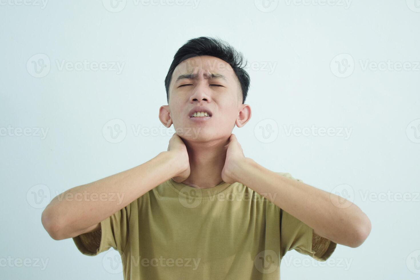 Close up asian young man touching neck in neckache or pain isolated on white background photo