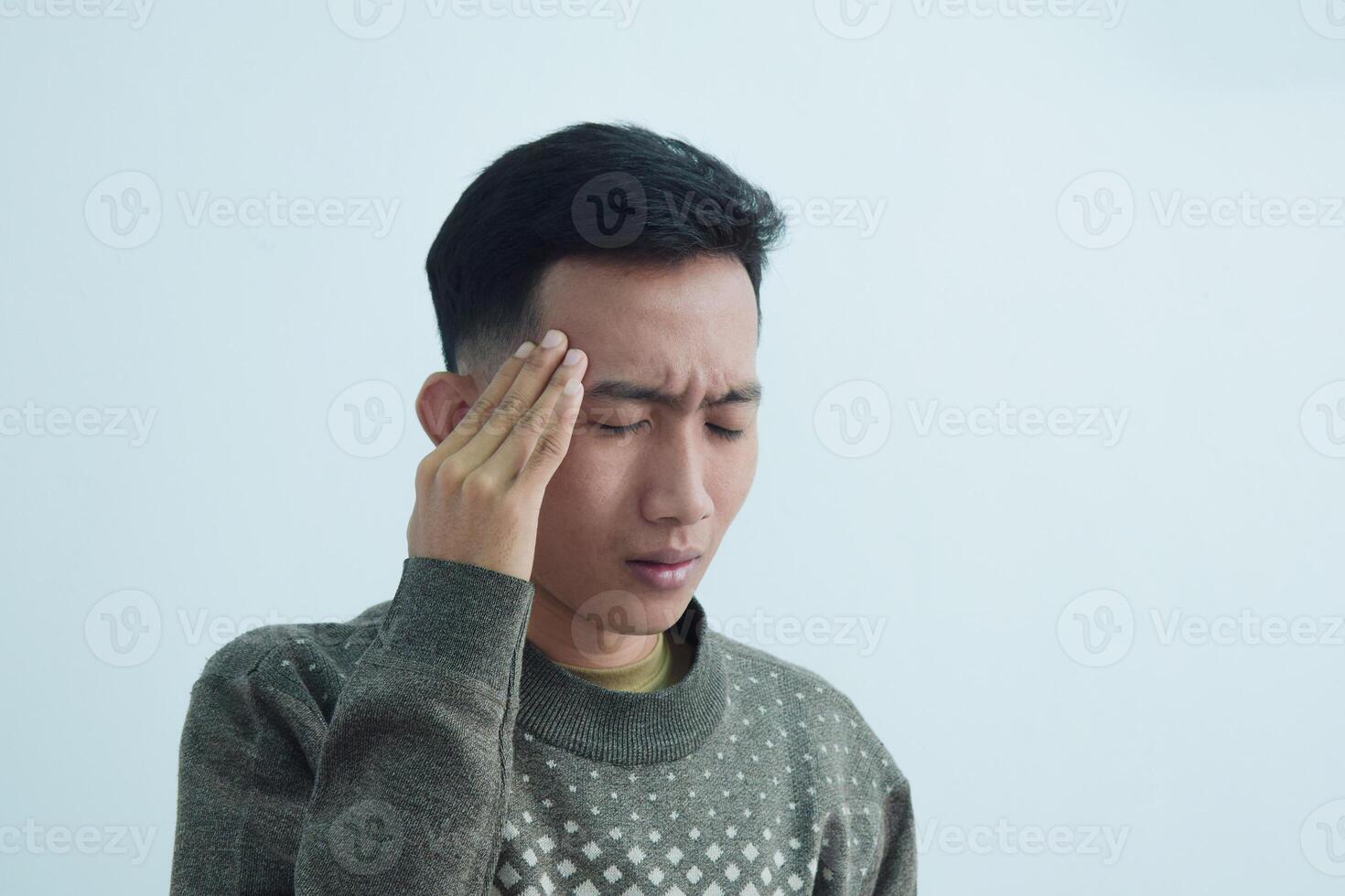 Close up asian young man touching head feel headache and pain isolated on white background photo