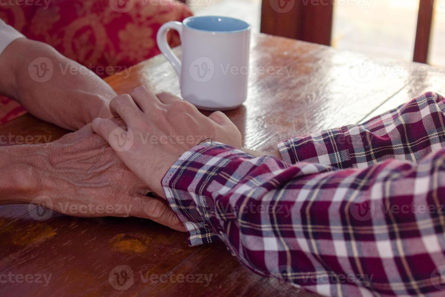 holding hand between son and father. Mental health, support and sharing, deep talking session photo
