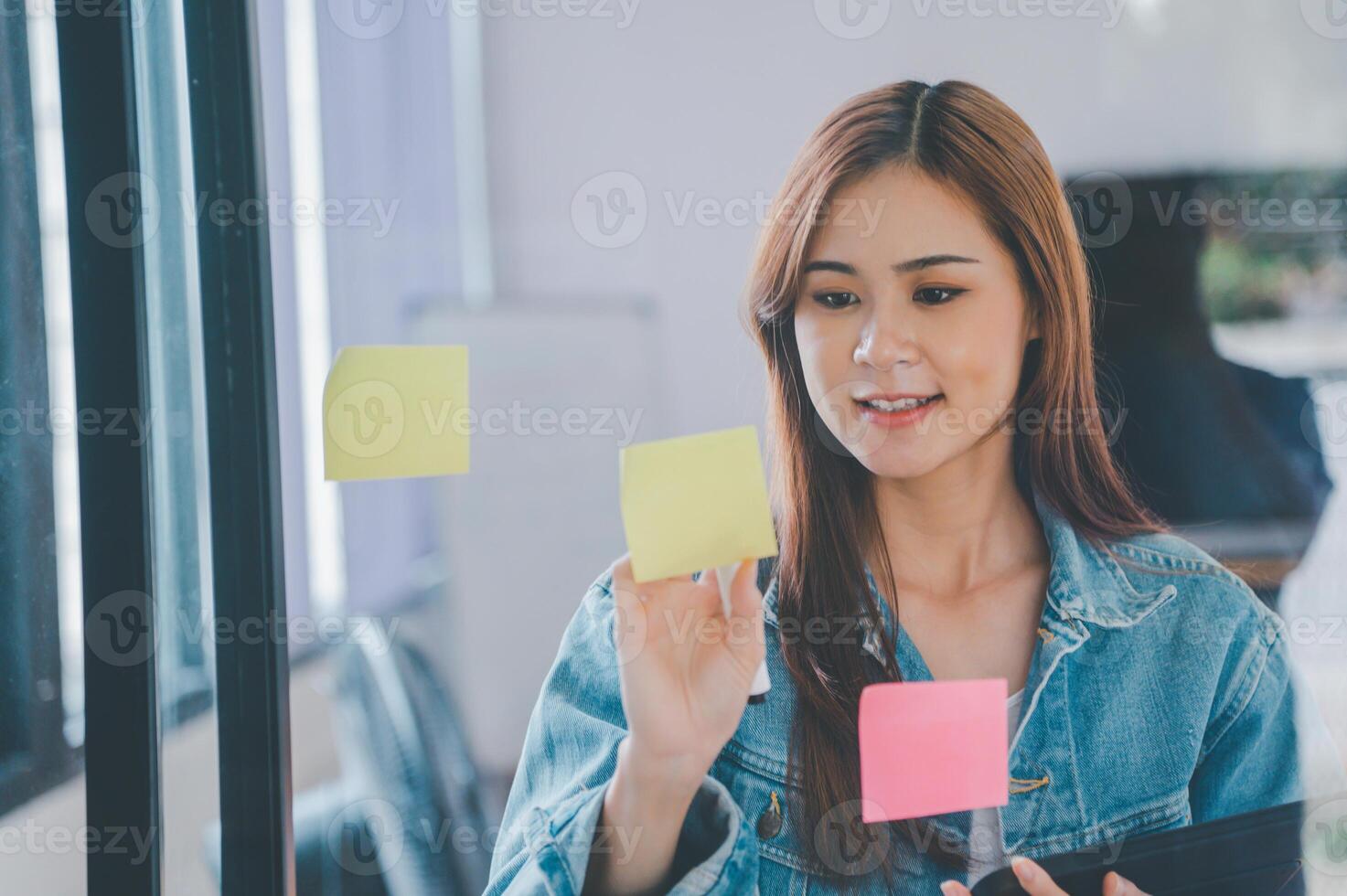Web designers creating planning and analyzing with Colorful sticky notes on the office board.web design concept photo