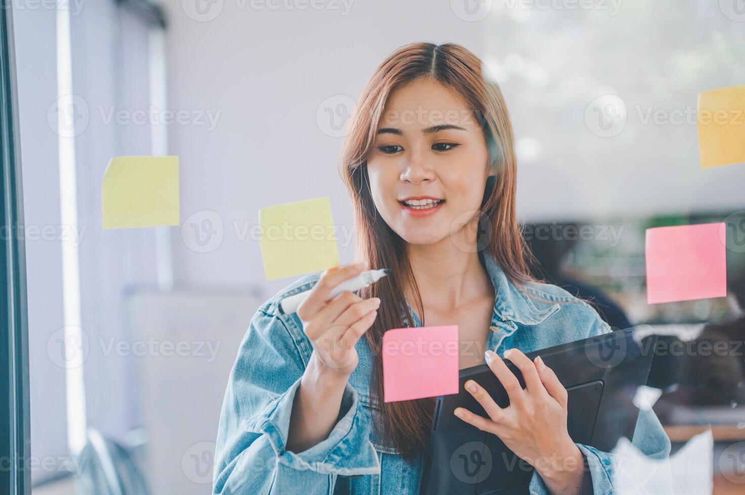 Web designers creating planning and analyzing with Colorful sticky notes on the office board.web design concept photo
