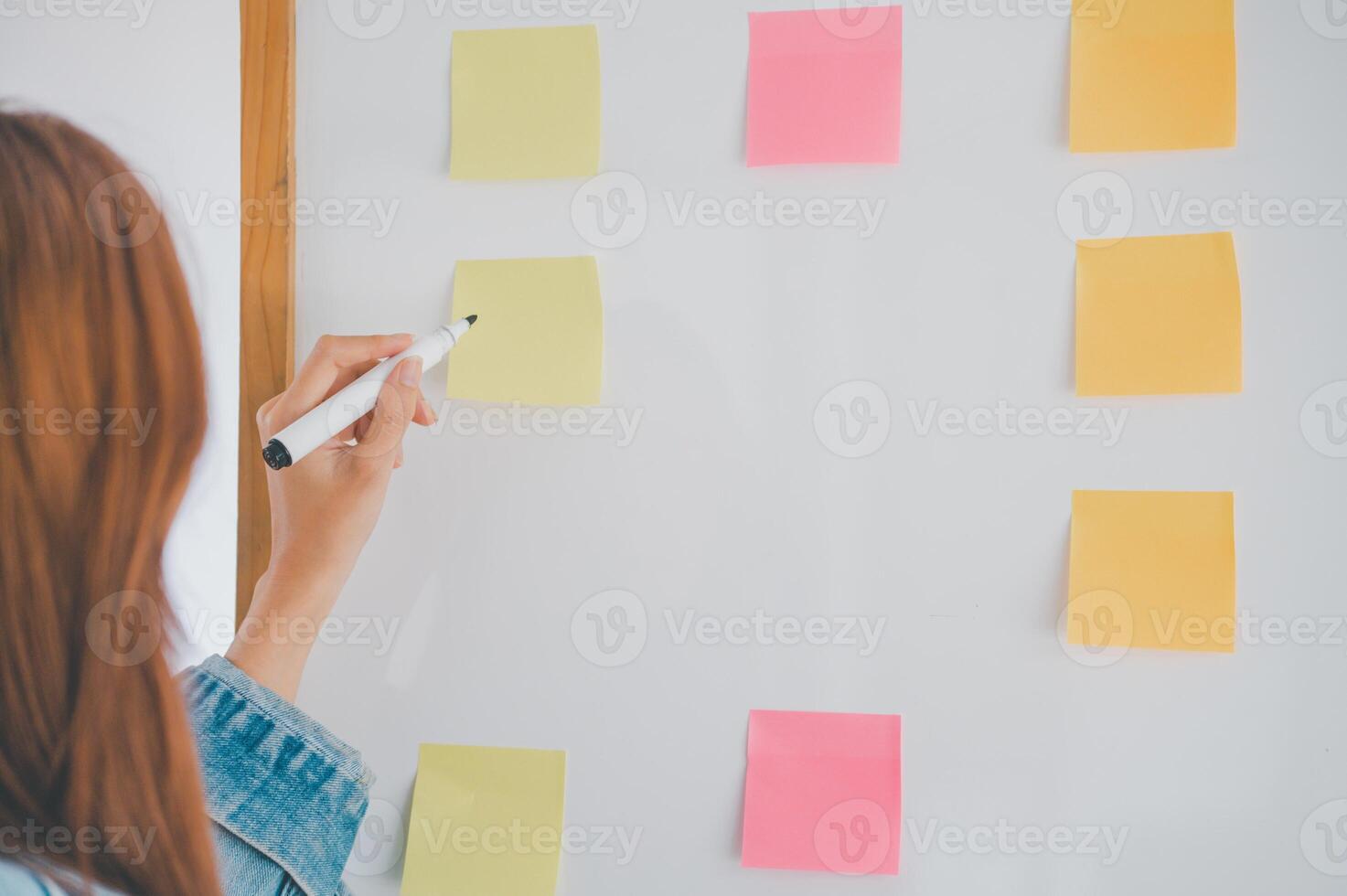 Web designers creating planning and analyzing with Colorful sticky notes on the office board.web design concept photo