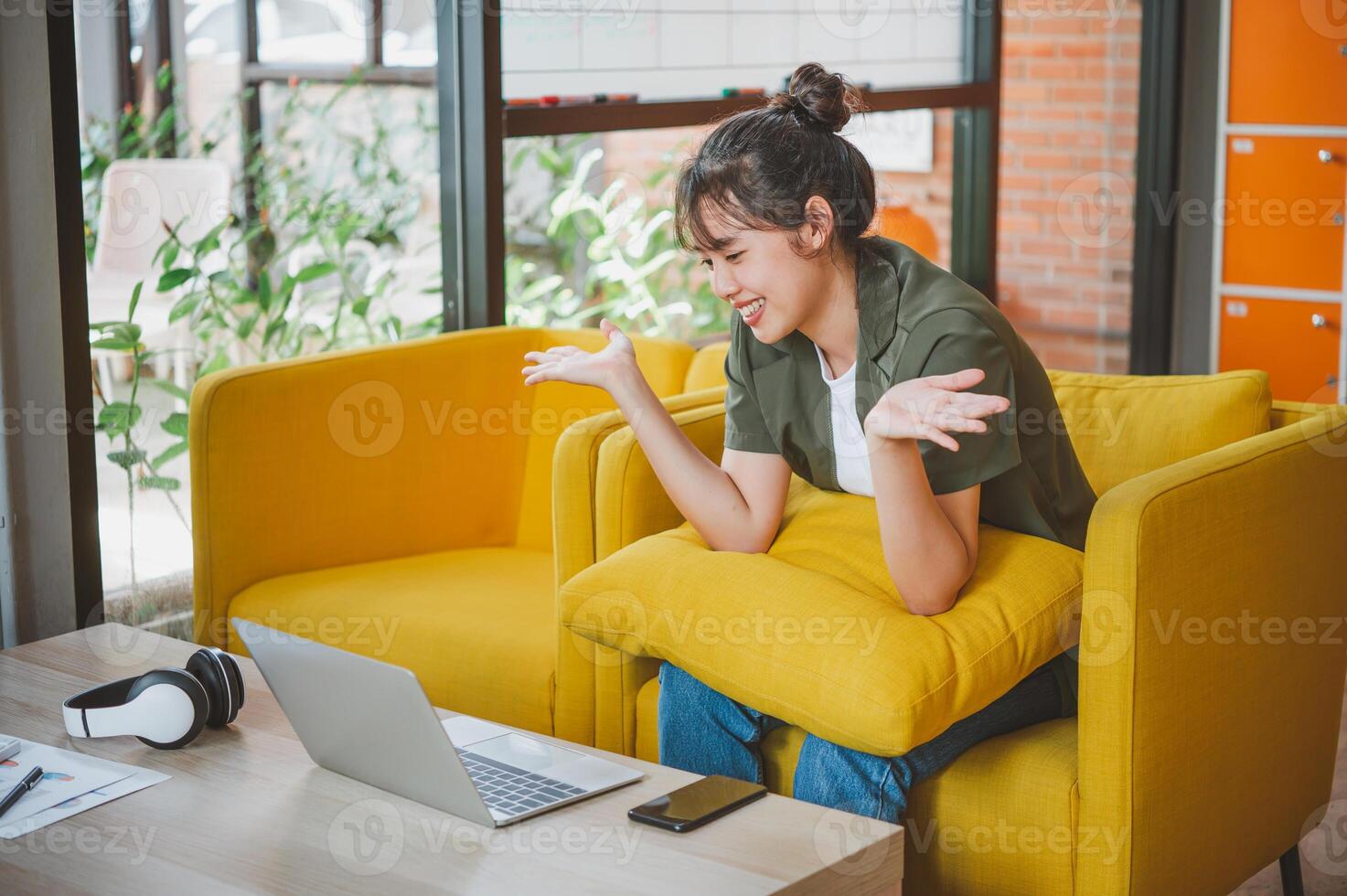 Teenage Asian are communicating through conferencing for online learning. In a conference call via apps. new normal concept photo
