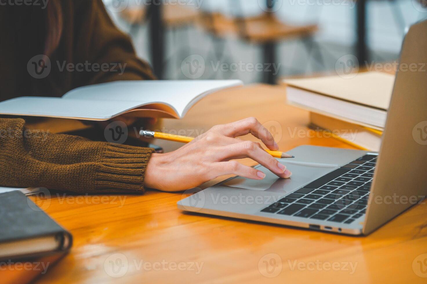 students working on laptop while studying online, distance learning, and keeps up to date on the global coronavirus pandemic. photo