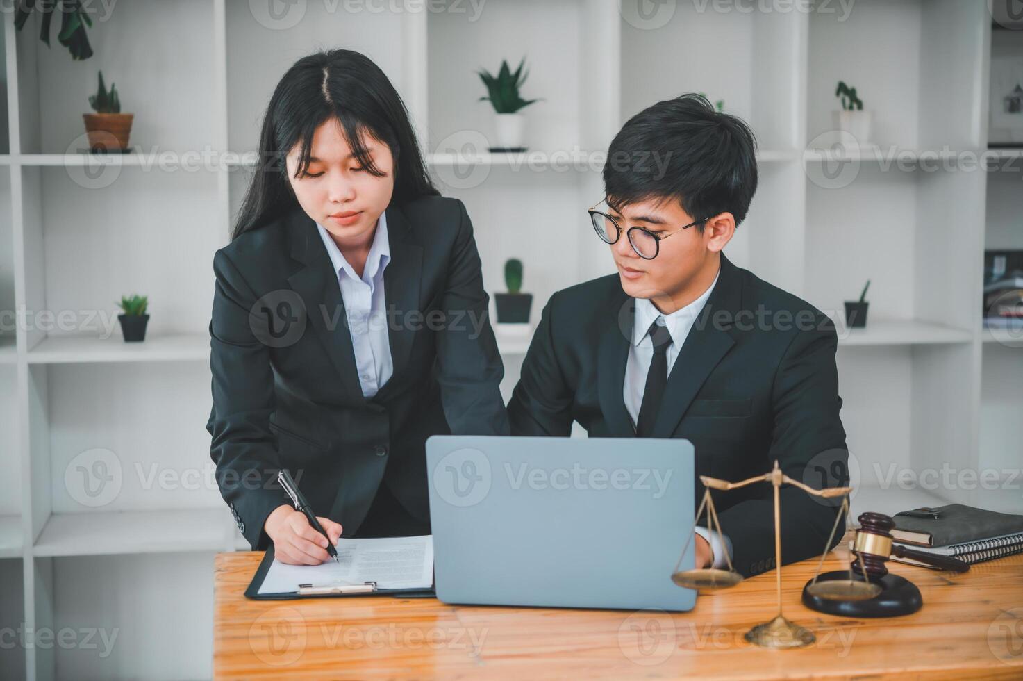 Law theme, mallet of the judge, law enforcement officers, evidence-based cases, and documents taken into account. photo