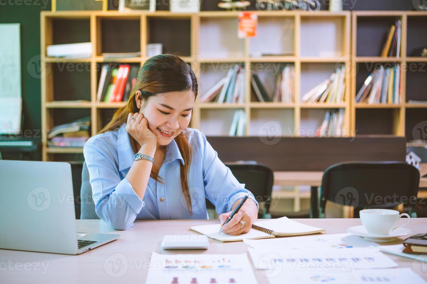 businessman pointing with pen on business report chart are working on accounts in business analysis with graphs and documentation. photo
