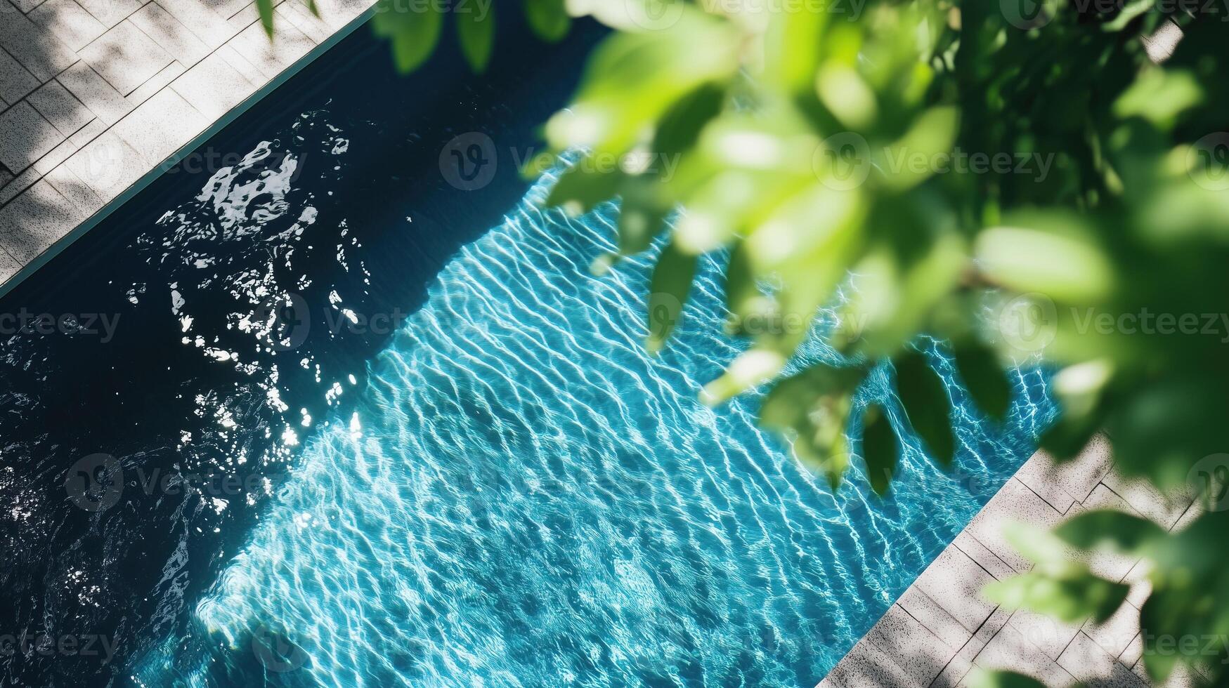 Summer swimming pool with blue water in the garden photo