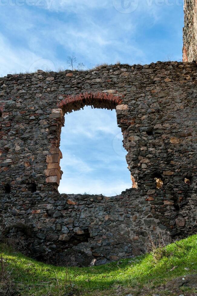 A wall with a window from the Soimos Fortress. Built in 1278 photo