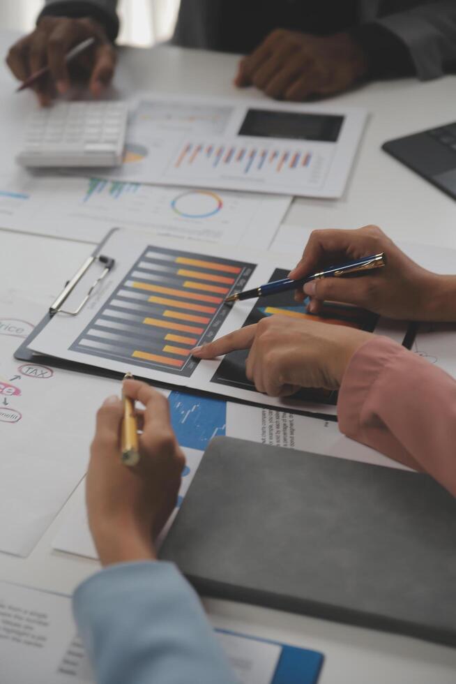 Close up of Business team analyzing income charts and graphs with modern laptop computer. Business analysis and strategy concept. photo