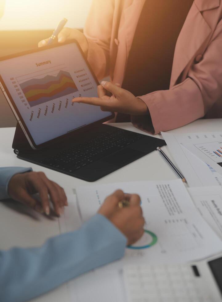 Close up of Business team analyzing income charts and graphs with modern laptop computer. Business analysis and strategy concept. photo