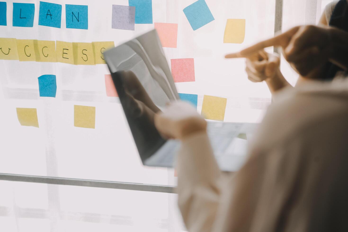 Financial analysts analyze business financial reports on a digital tablet planning investment project during a discussion at a meeting of corporate showing the results of their successful teamwork. photo