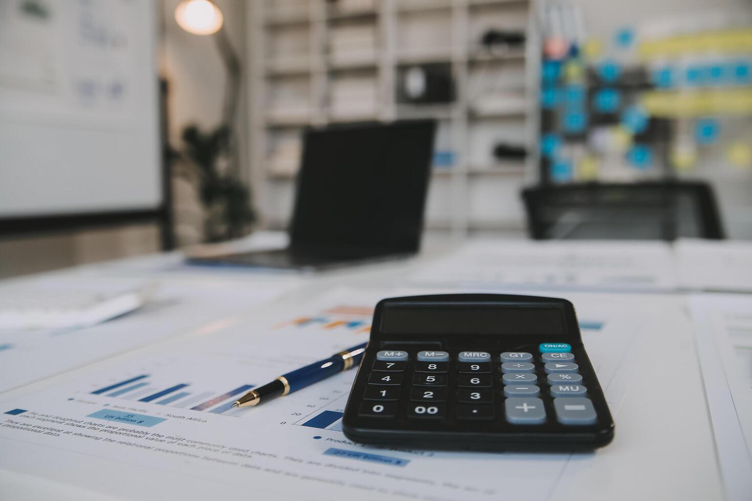 Financial analysts analyze business financial reports on a digital tablet planning investment project during a discussion at a meeting of corporate showing the results of their successful teamwork. photo