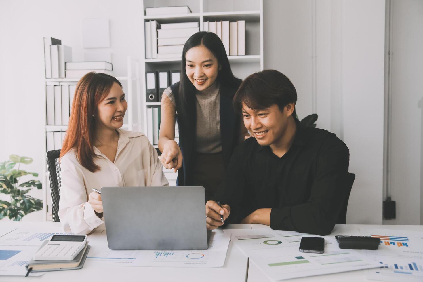 Financial analysts analyze business financial reports on a digital tablet planning investment project during a discussion at a meeting of corporate showing the results of their successful teamwork. photo