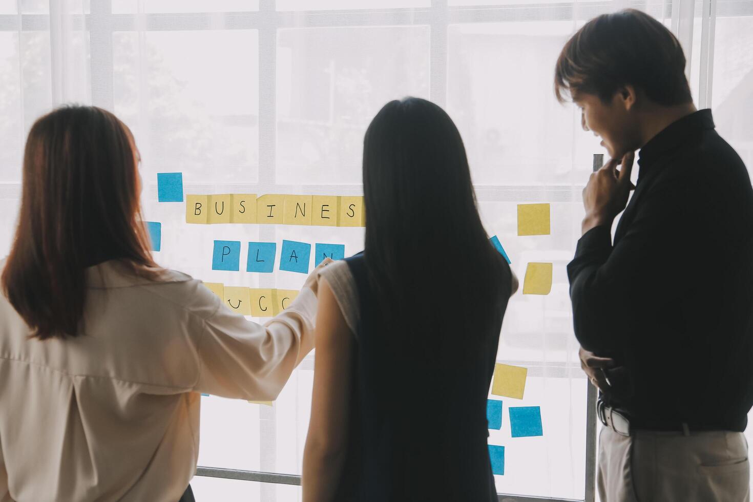 Financial analysts analyze business financial reports on a digital tablet planning investment project during a discussion at a meeting of corporate showing the results of their successful teamwork. photo