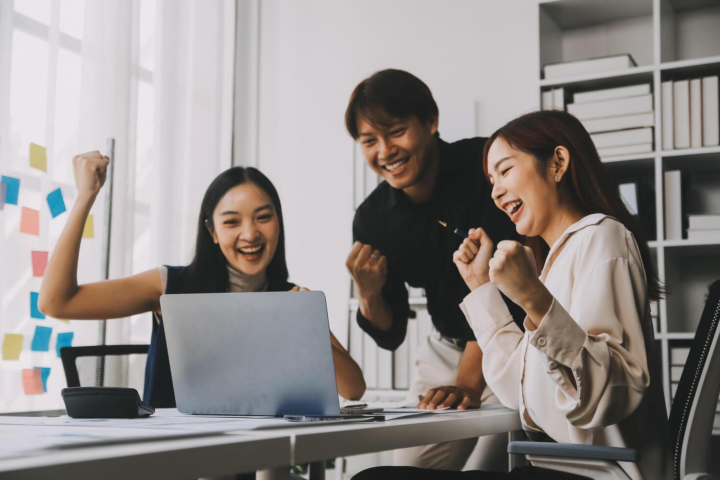 Financial analysts analyze business financial reports on a digital tablet planning investment project during a discussion at a meeting of corporate showing the results of their successful teamwork. photo