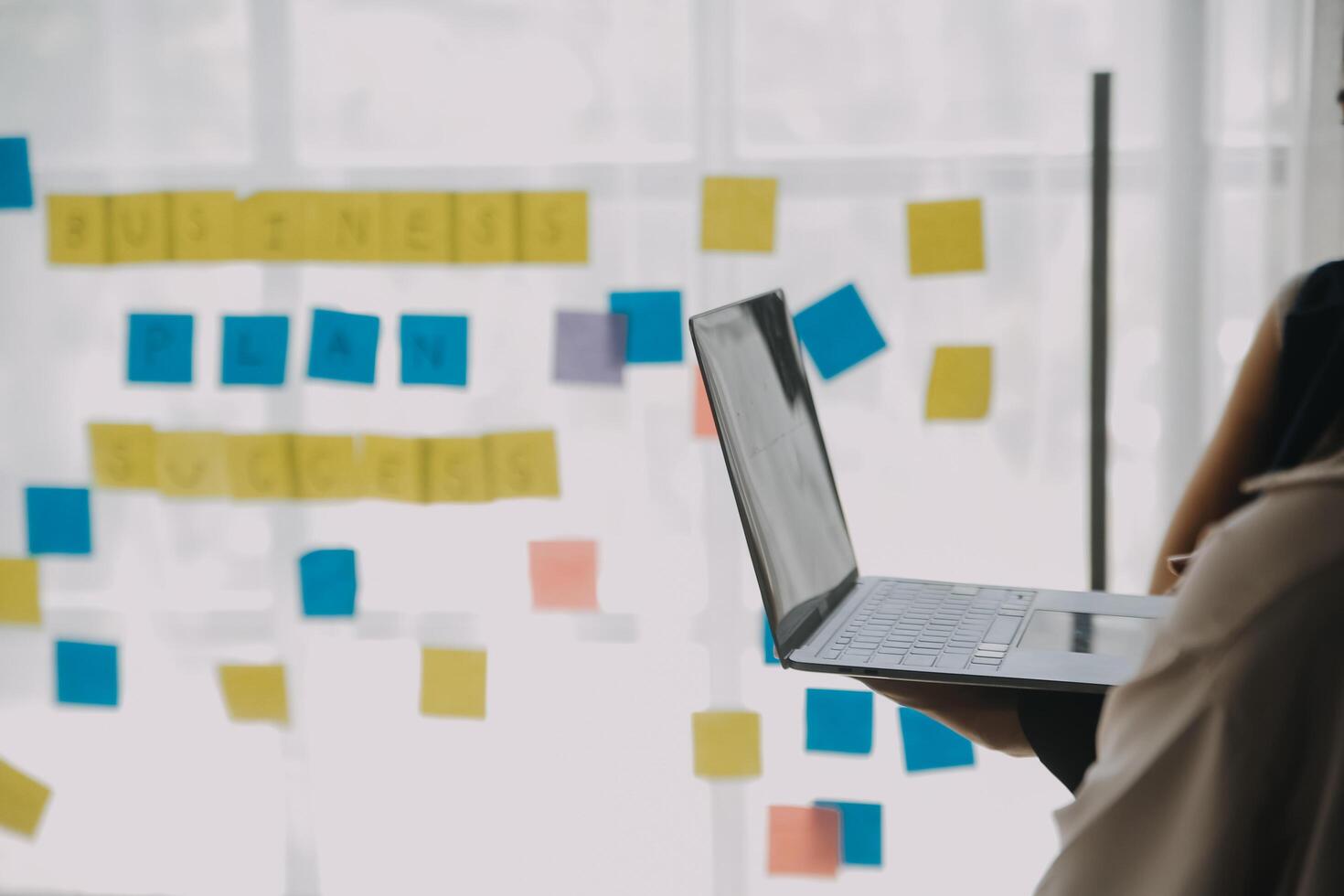Financial analysts analyze business financial reports on a digital tablet planning investment project during a discussion at a meeting of corporate showing the results of their successful teamwork. photo