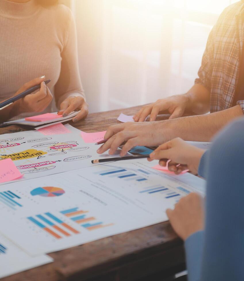 Team of business people working together in the meeting room office, teamwork background charts and graphs banner, double exposure successful teamwork,business planning concept. photo