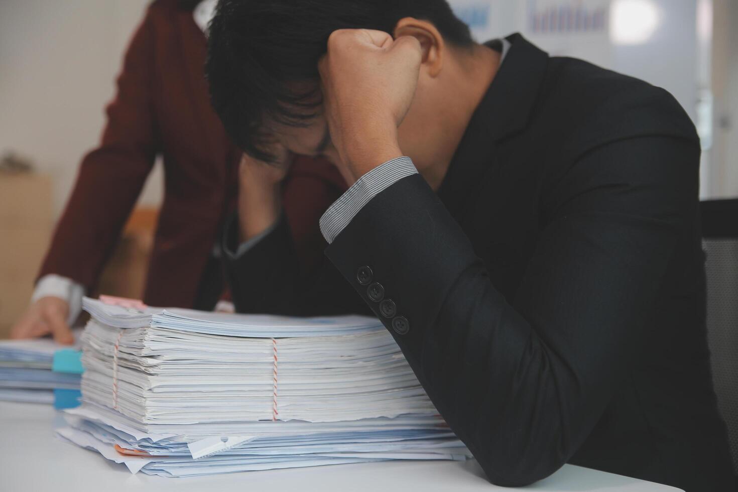 Audit concept,Administrator business man financial inspector and secretary making report calculating balance. Internal Revenue Service checking document. photo