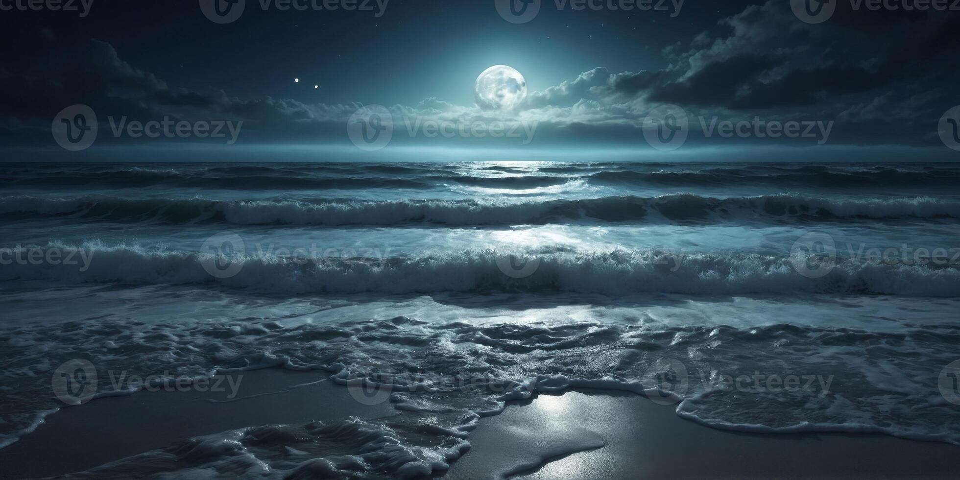 a moonlit beach with the full moon casting a silver path across the dark waters and illuminating the foamy edges of the waves as they meet the shore. photo