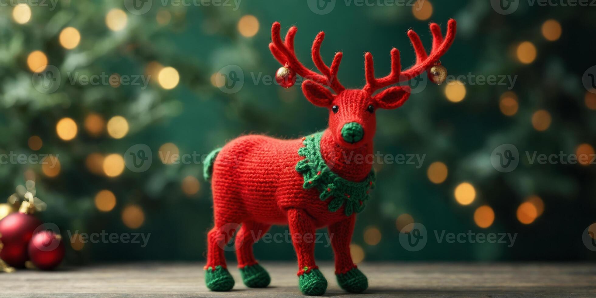 Red and green knitted Christmas reindeer. photo