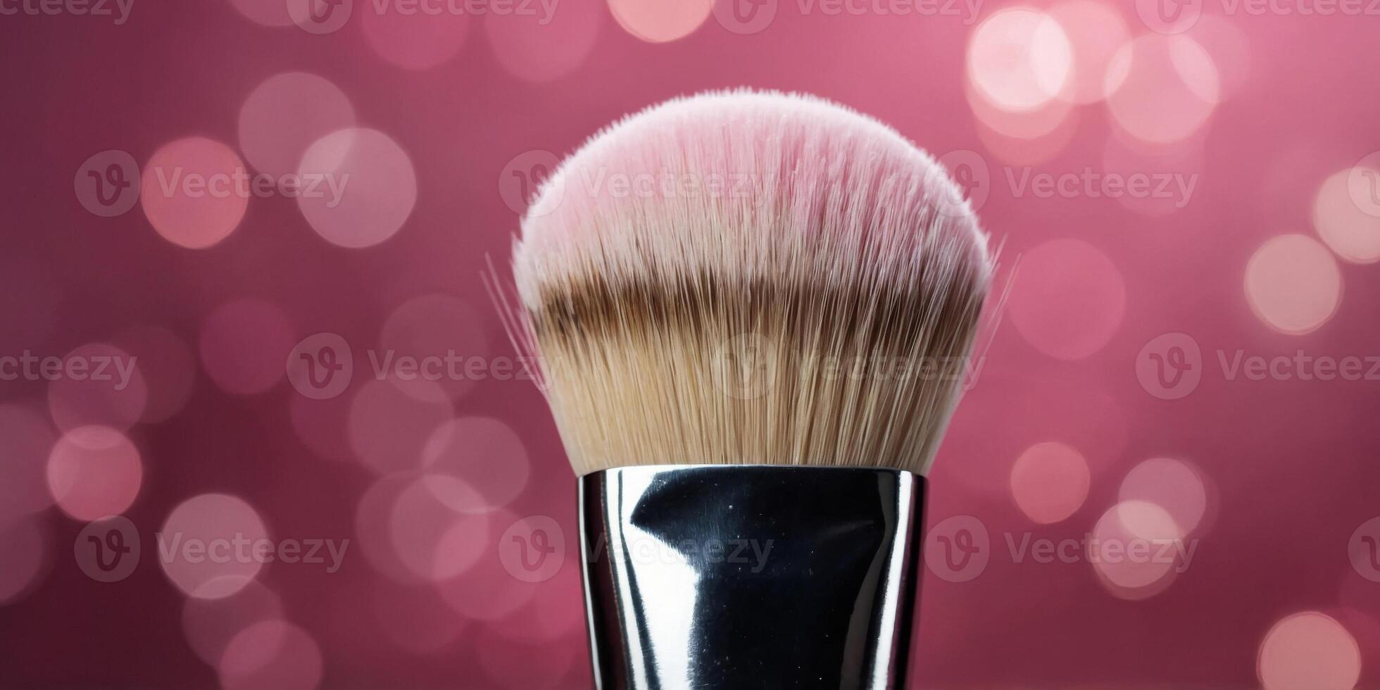Pink short blusher makeup brush with blurry background. photo