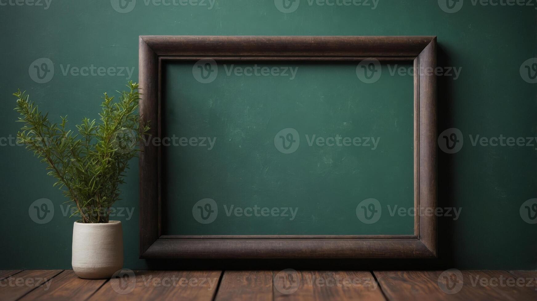 Empty dark wooden picture frame on old green wall. photo