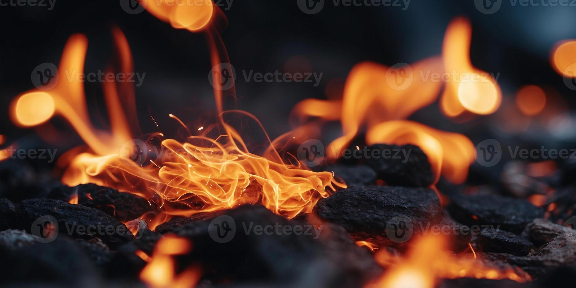 Black background with flaming sparks sparks flying from a fire flame Hot coals in the fire shoot flaming red sparks. photo