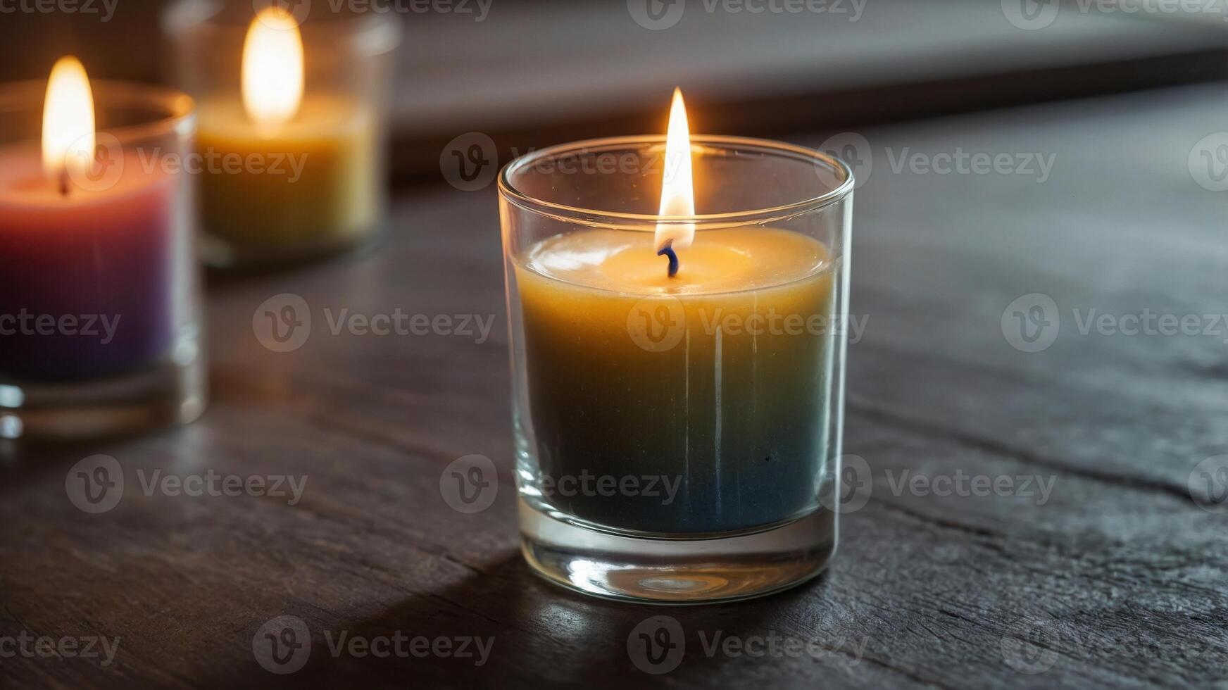 Glass candle with empty label in natural sunlight. photo