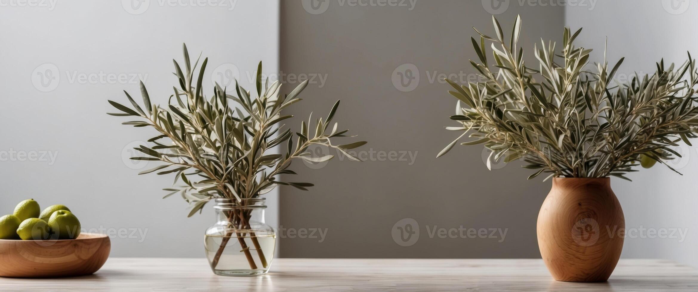 Olive branches in a vase and wooden board over the white tile wall. photo