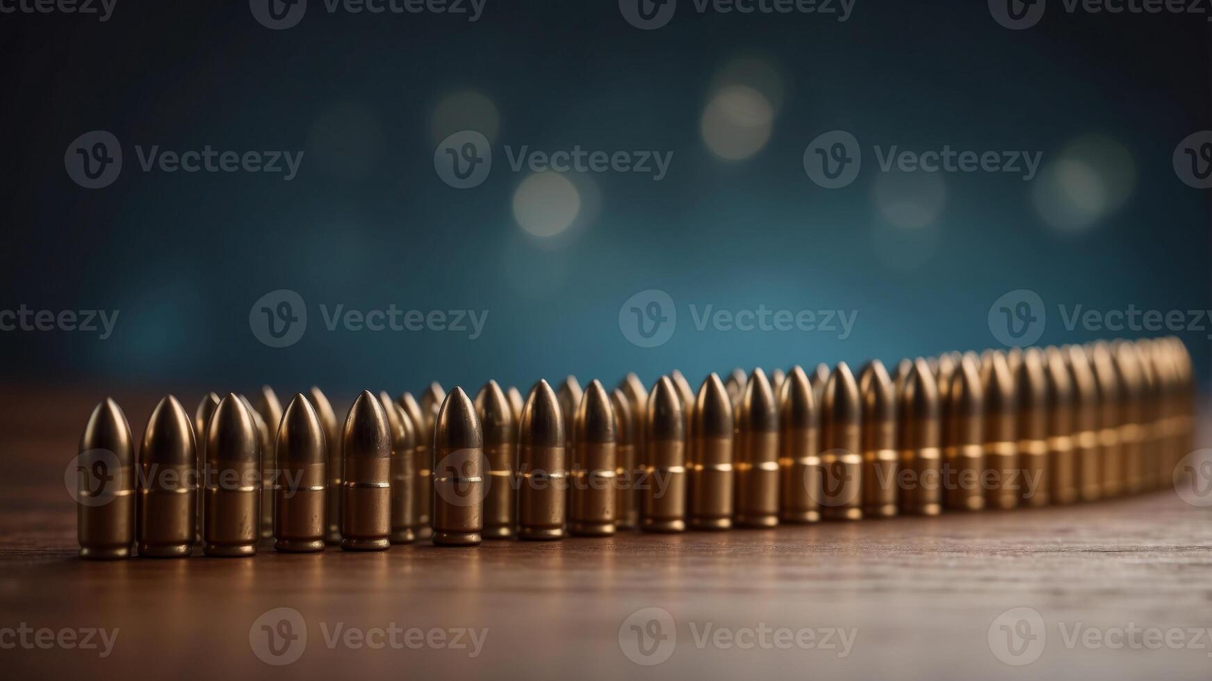 A row of bullets are lined up on a table. photo