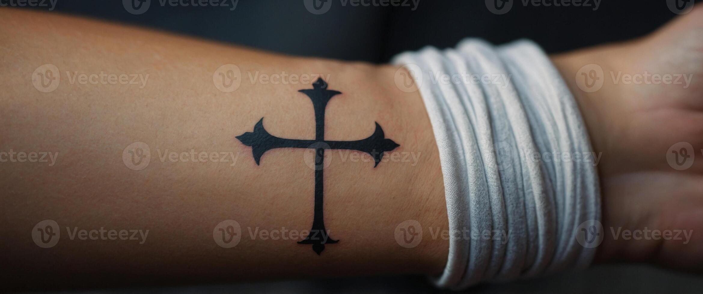 Minimalist Cross Tattoo on Wrist with Copy Space. photo