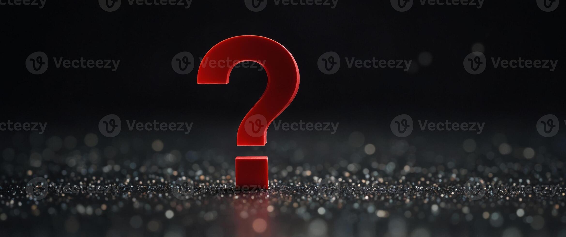 A red question mark is on a black background. photo