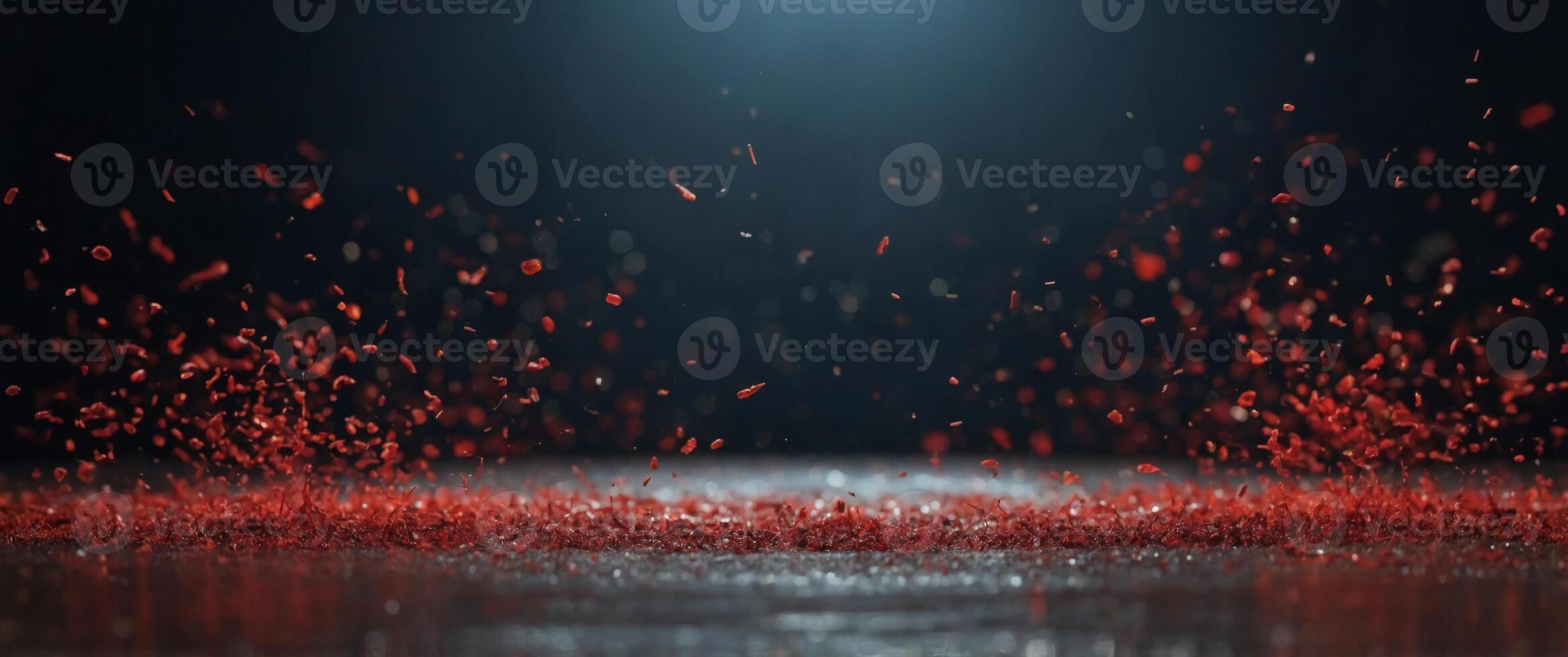 Stage ground littered with red particles. photo