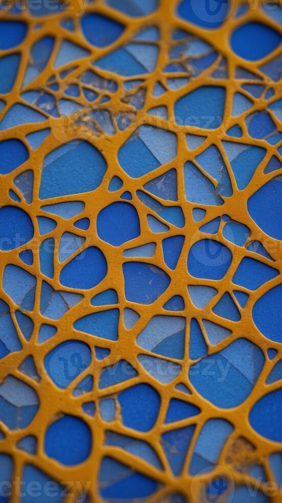 An close up of a blue tile with a design on it. photo