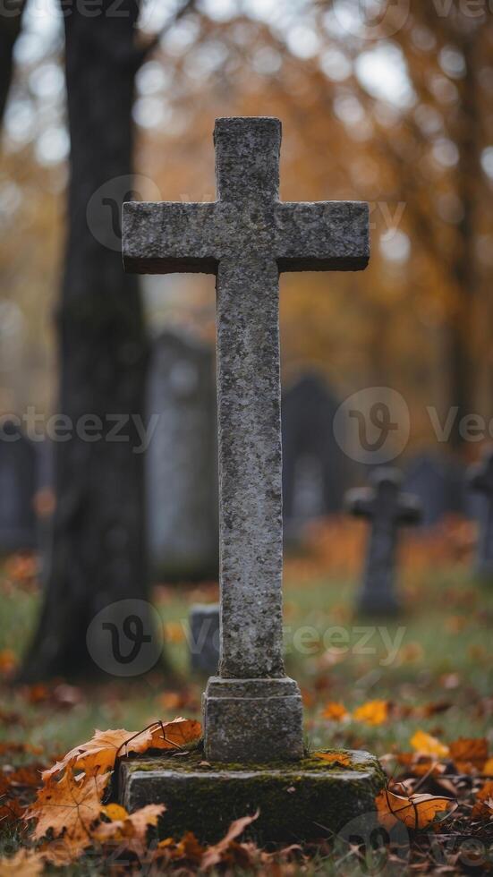 Weathered Ancient Stone Cross in a Peaceful Graveyard with Atmospheric Autumn Landscape. photo